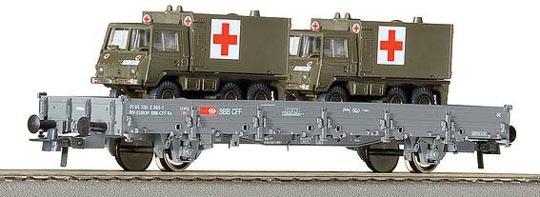 Flat car loade with 2 Swiss Army ambulance vehicles<br /><a href='images/pictures/Roco/66682.jpg' target='_blank'>Full size image</a>